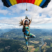 woman parachuting in a yoga pose
