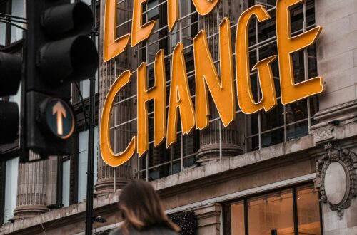 sign that say's Lets Change on the side of the building