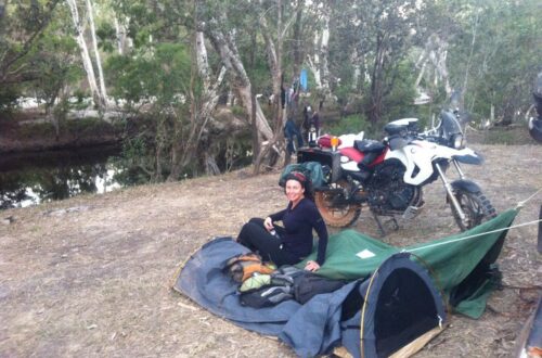 Camping by a river with swags with a motorbikes in the top end of australia