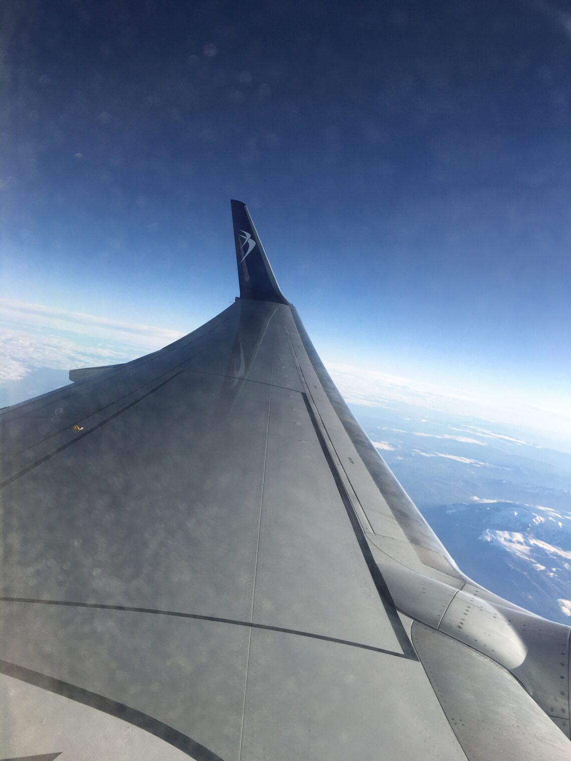 Wing on an aircraft in the sky
