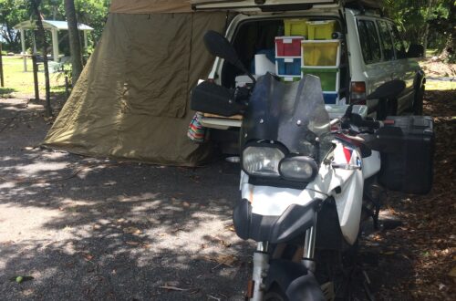 Camping with a motorbike in front