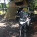 Camping with a motorbike in front