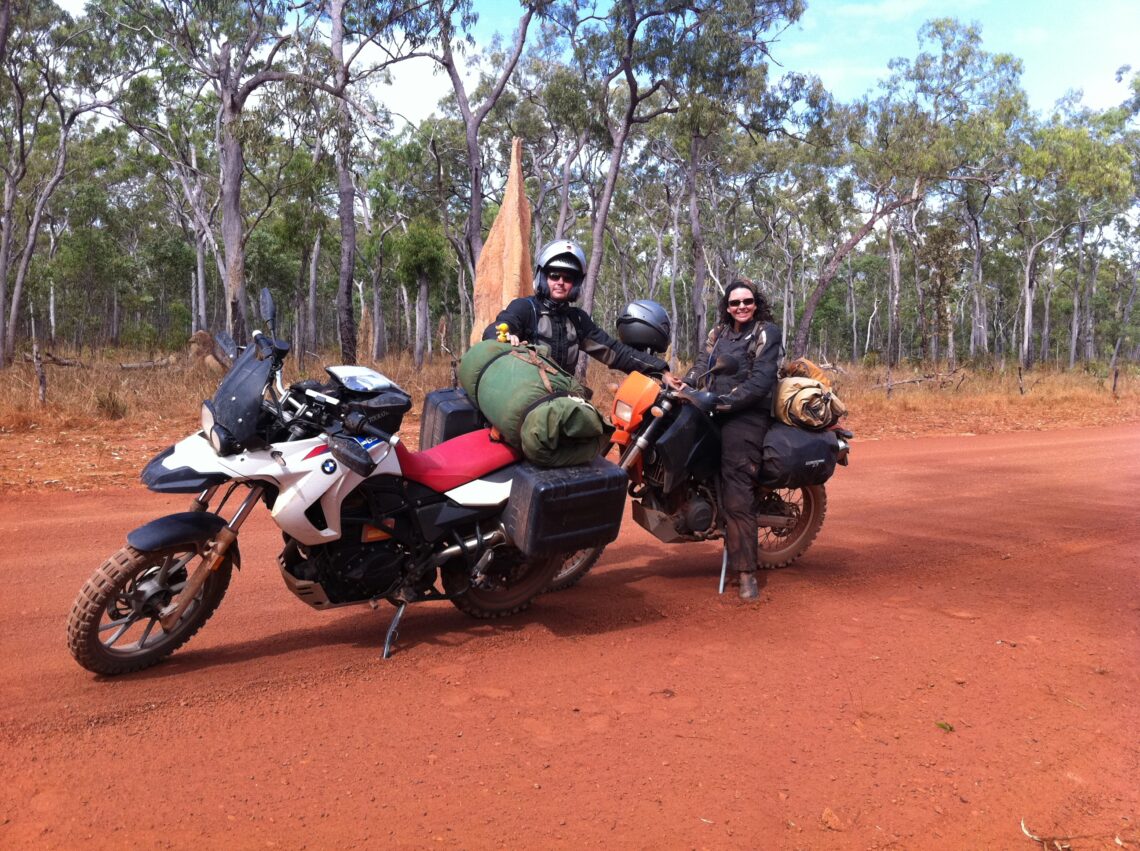 Two motorbikes and two people in the outback of Australia