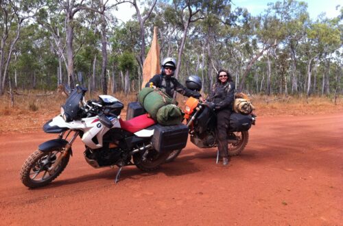 Two motorbikes and two people in the outback of Australia