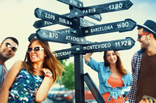 people in front of a sign with destinations