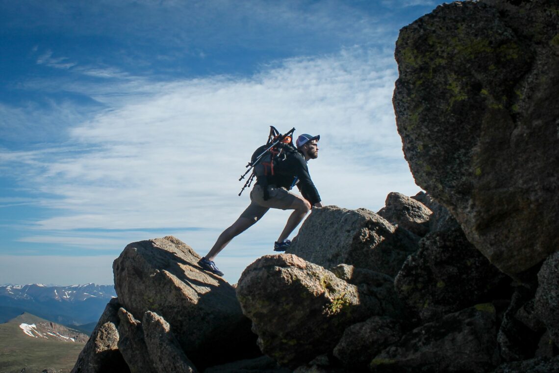 A man Climbing on a mountain